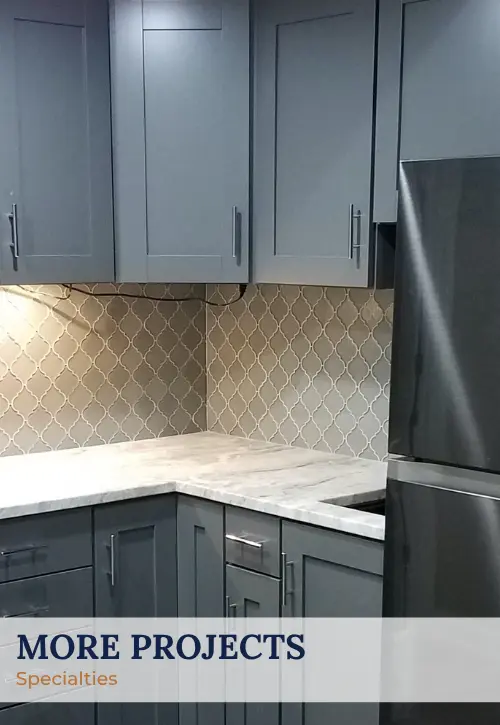 Custom basement kitchenette with gray shaker cabinets and arabesque backsplash – designed and built by Ntegrity Builders in Central Indiana