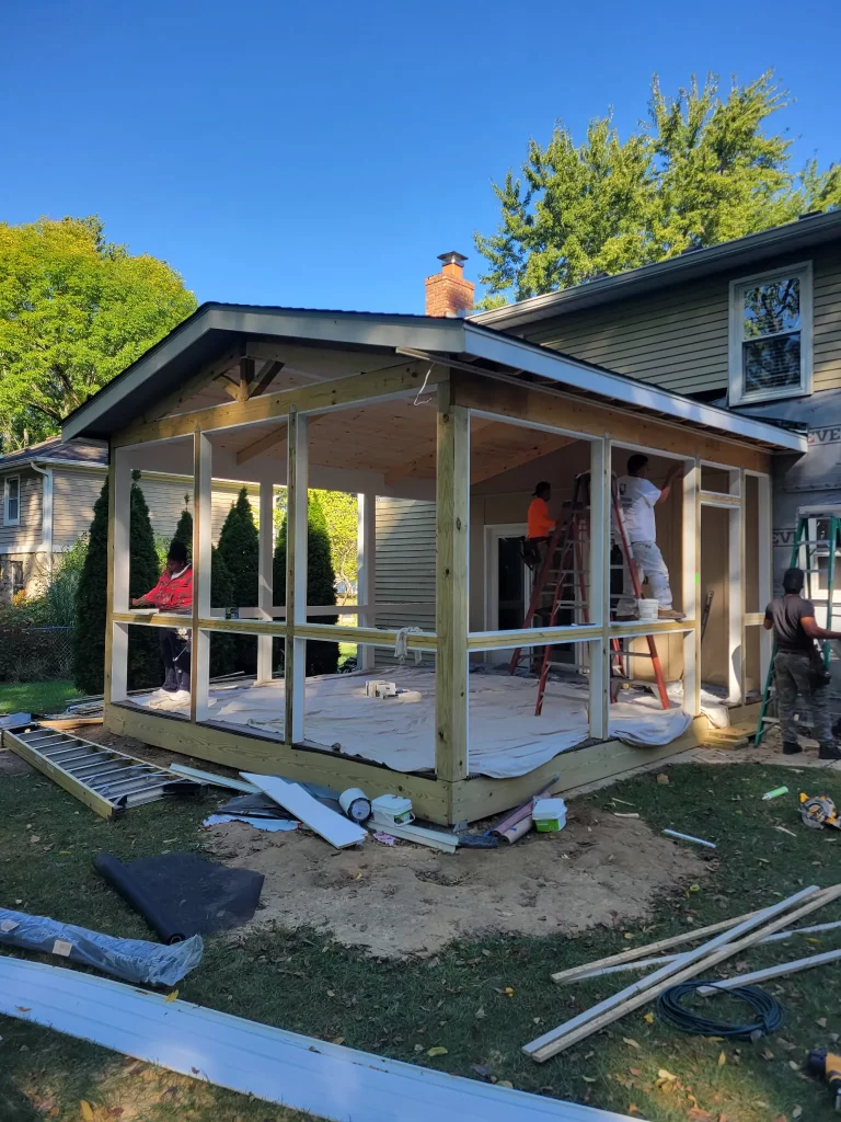 Screened porch under construction with tongue and groove wood ceiling installed by Ntegrity Builders in Carmel, Indiana.