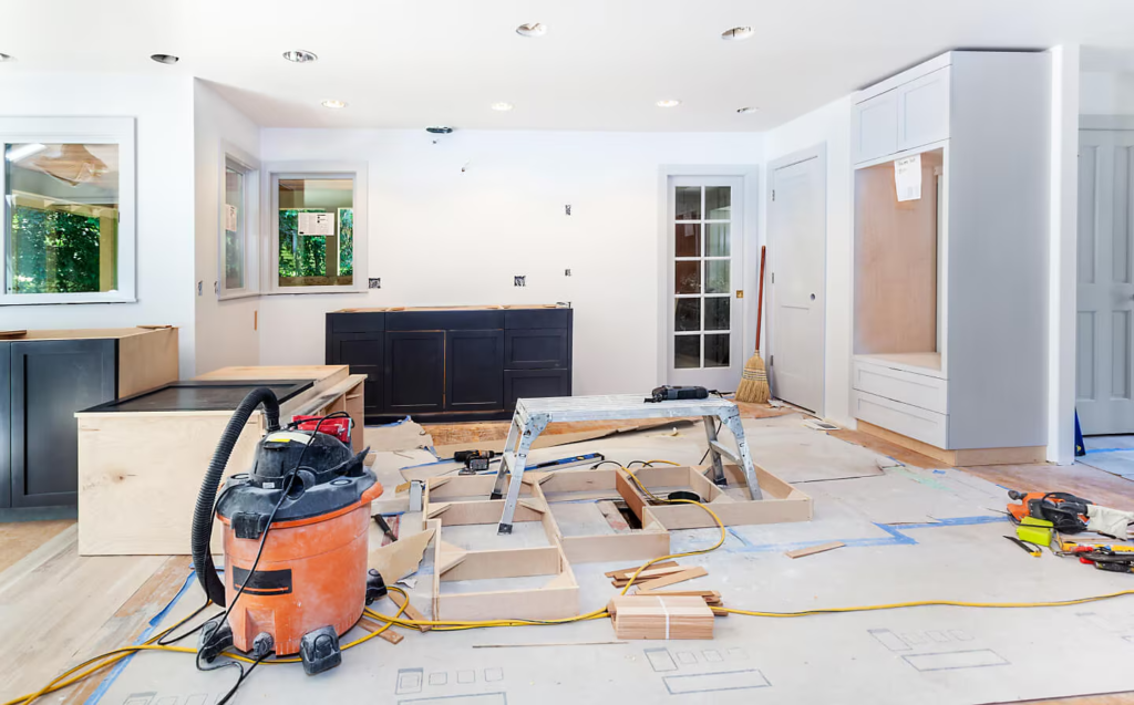 Design build process remodeling project in progress with construction materials and tools