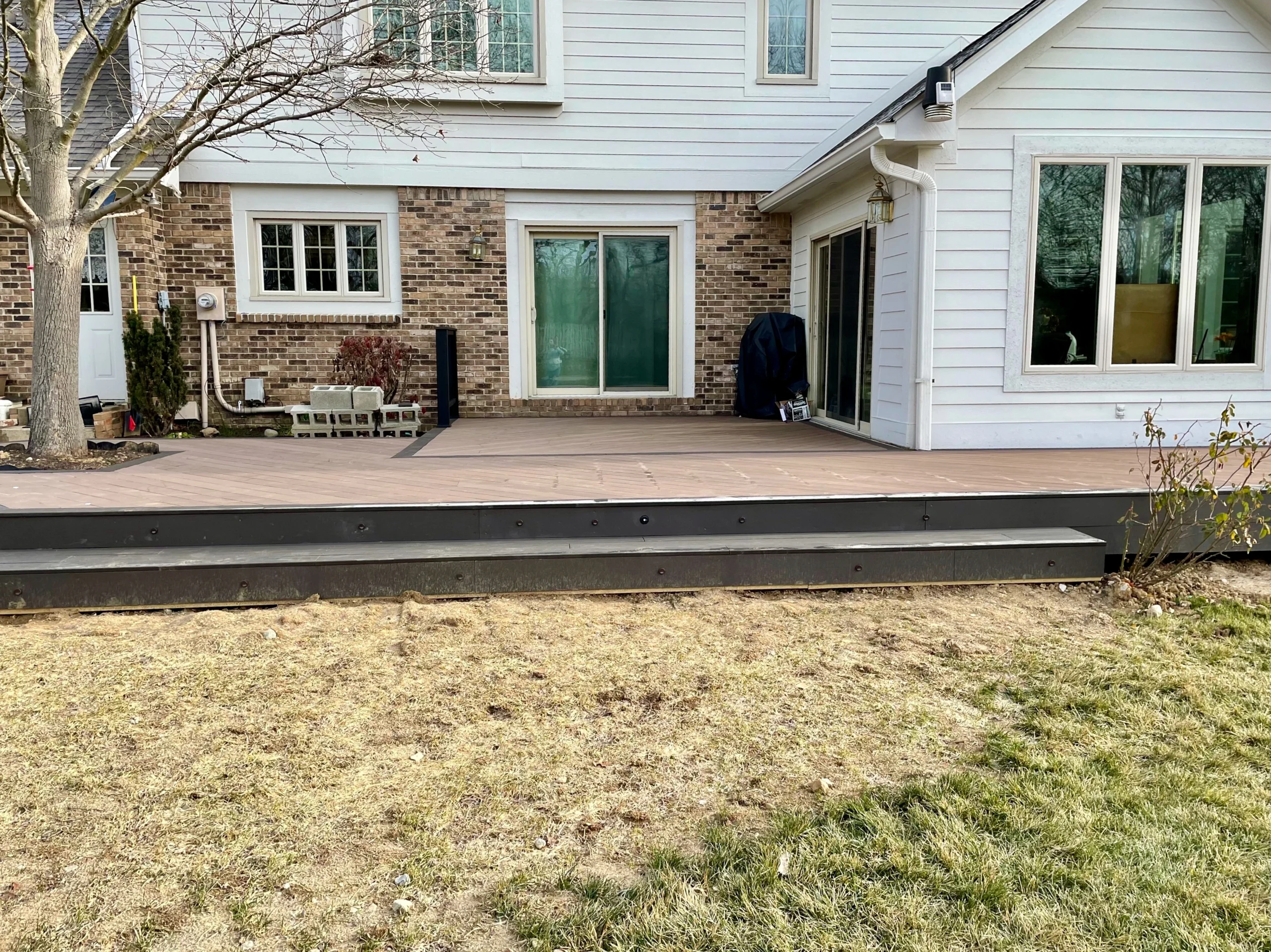 Custom Cali Bamboo composite deck around a mature tree in Carmel, Indiana