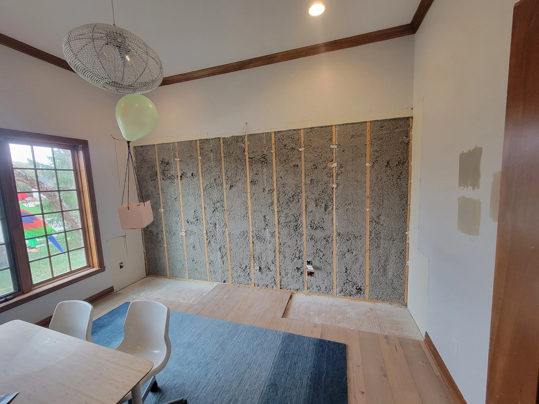 Wall opened during a den remodel in Carmel Indiana after original built-in cabinetry was removed.