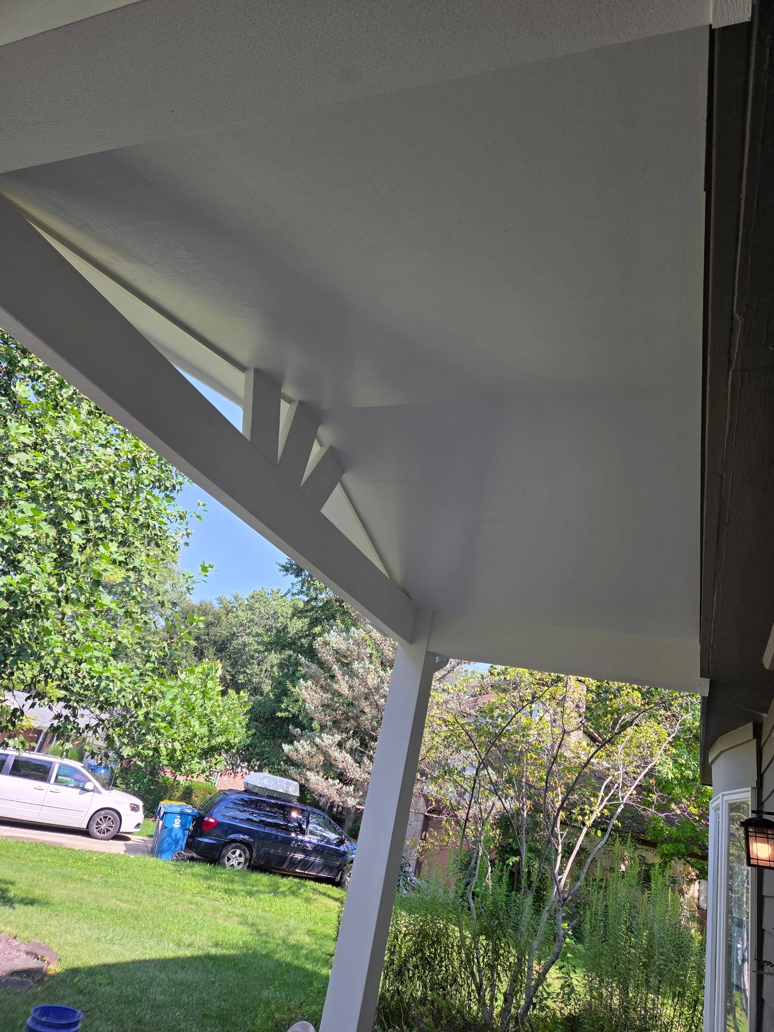Finished porch ceiling and decorative gable detail on a covered front porch in Carmel Indiana
