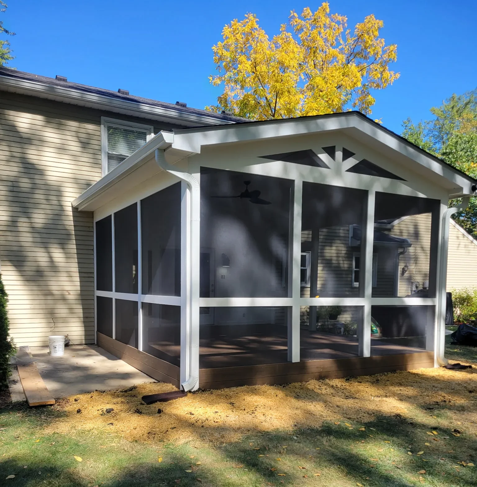 Finished screened porch addition viewed from the opposite side of a Carmel home
