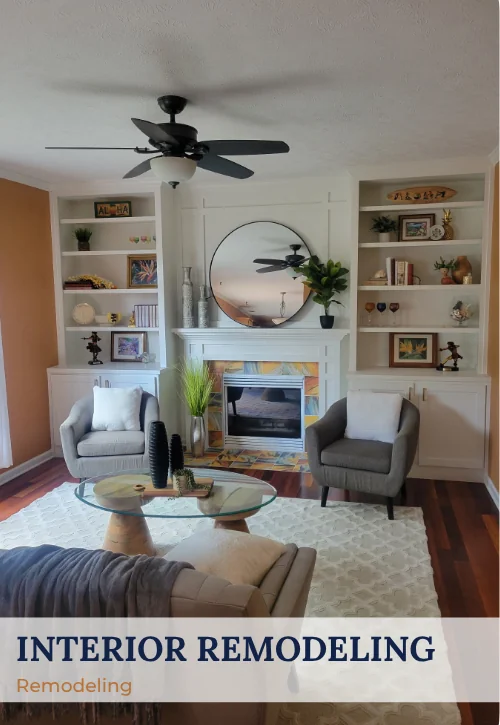 Remodeled living room with white built-ins, fireplace surround, mirror, seating area, and updated finishes