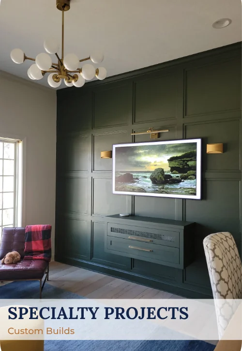 Custom interior feature wall with dark paneling, mounted television, built-in media cabinet, and modern lighting