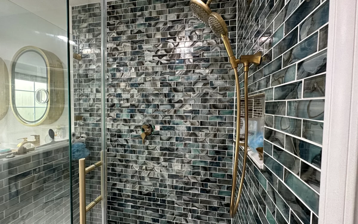 Completed shower with custom niches and glass tile walls in Carmel master bathroom remodel